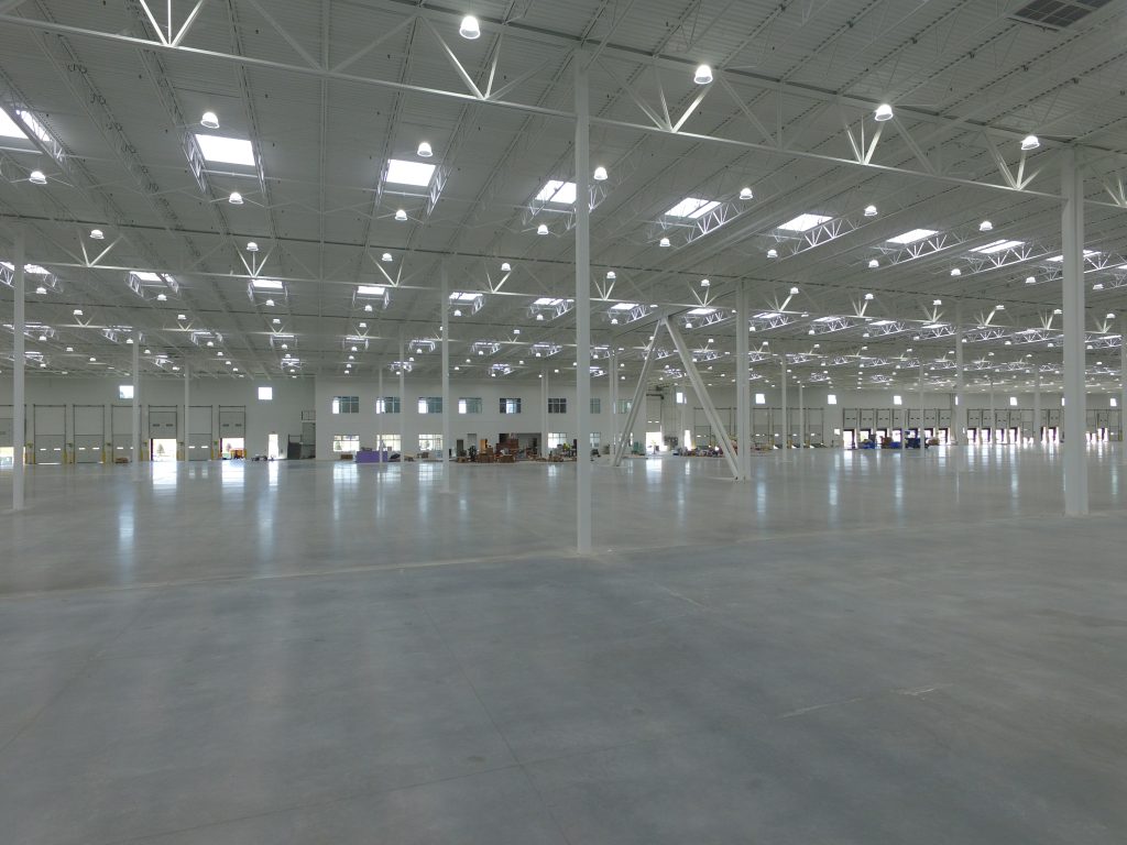 Shiny concrete finish inside a completed industrial building.