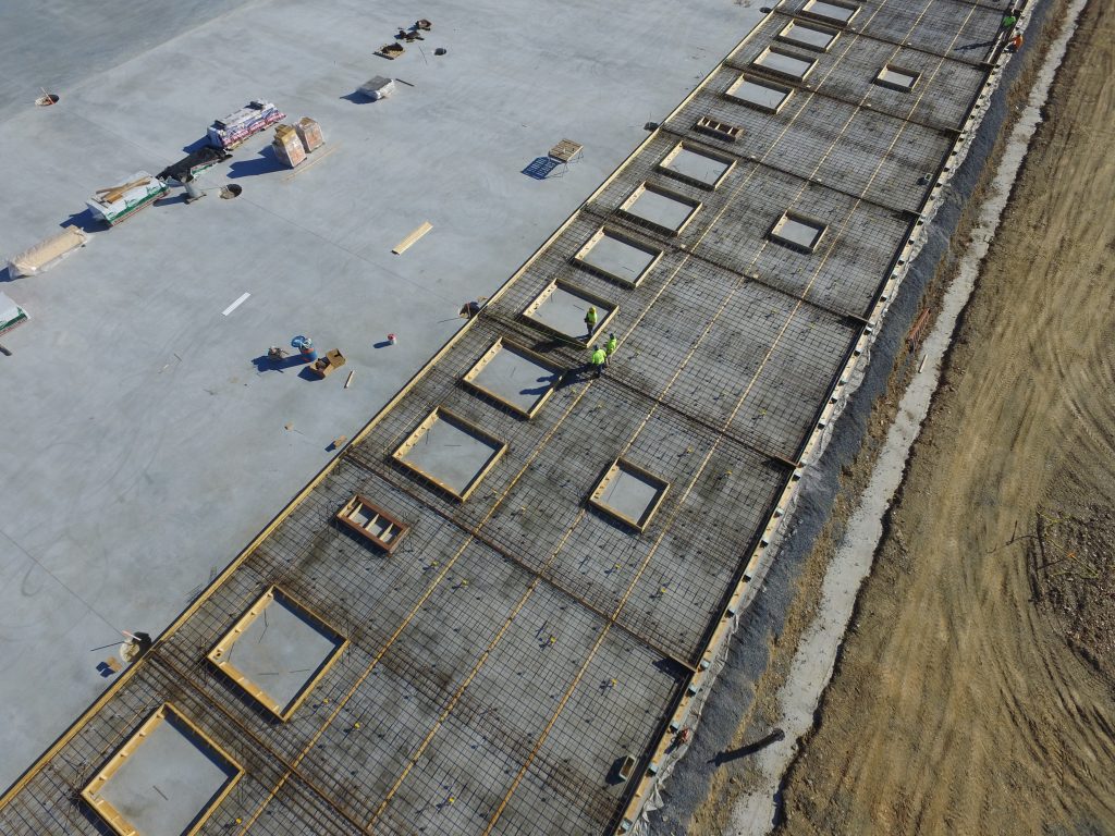 Tilt panels cast on a building slab and reinforce with rebar, ready to be poured.
