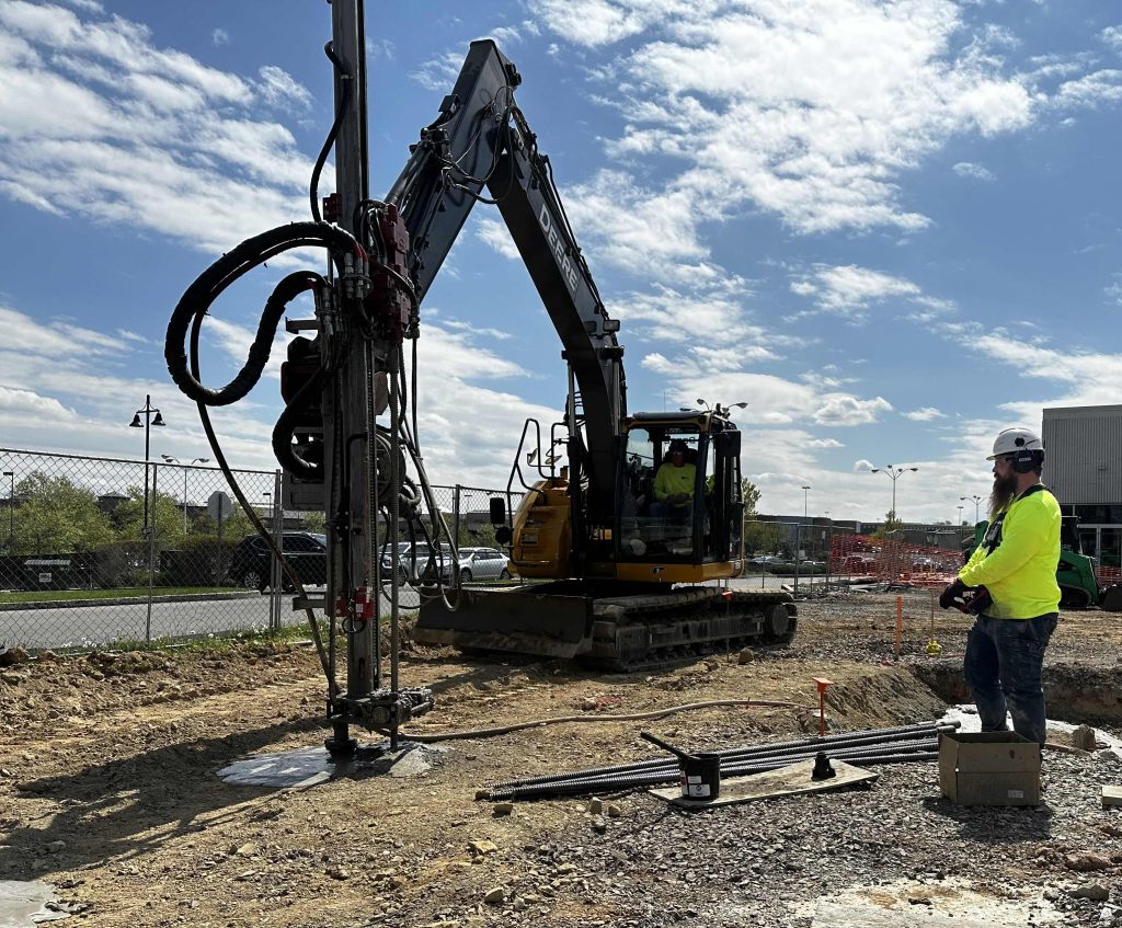 Micropile being drilled into the ground.